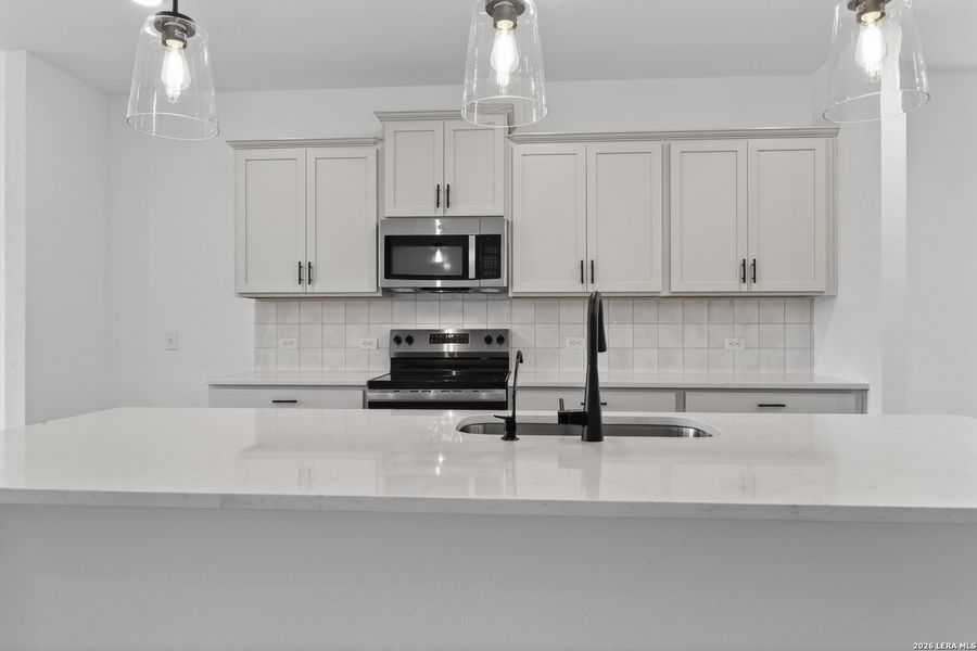 Furnished interior view inside a new home in Hennersby Hollow, San Antonio (Image 13).