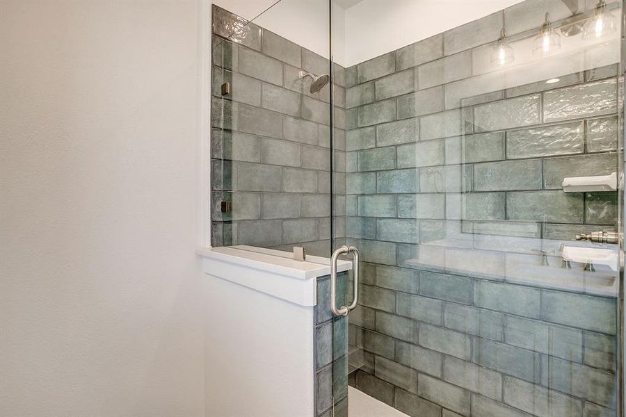 Bathroom featuring a shower stall Bathroom featuring a shower stall
