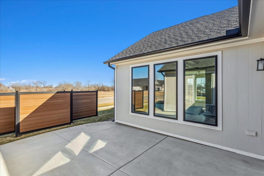 Exterior details and patio area of a home in The Courtyards at Jacobs Farm, Wichita (Image 3).