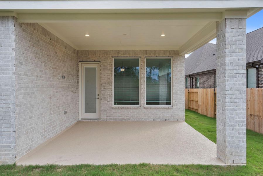 Exterior details and patio area of a home in The Trails, New Caney (Image 3).