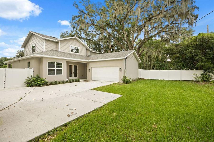 Front exterior of a new home in , Orlando, FL, highlighting curb appeal (Image 24). Front exterior of a new home in , Orlando, FL, highlighting curb appeal (Image 24).