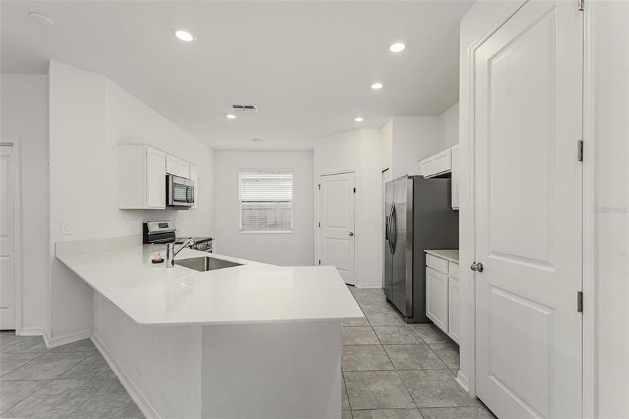Furnished interior view inside a new home in , Winter Haven (Image 8). Furnished interior view inside a new home in , Winter Haven (Image 8).