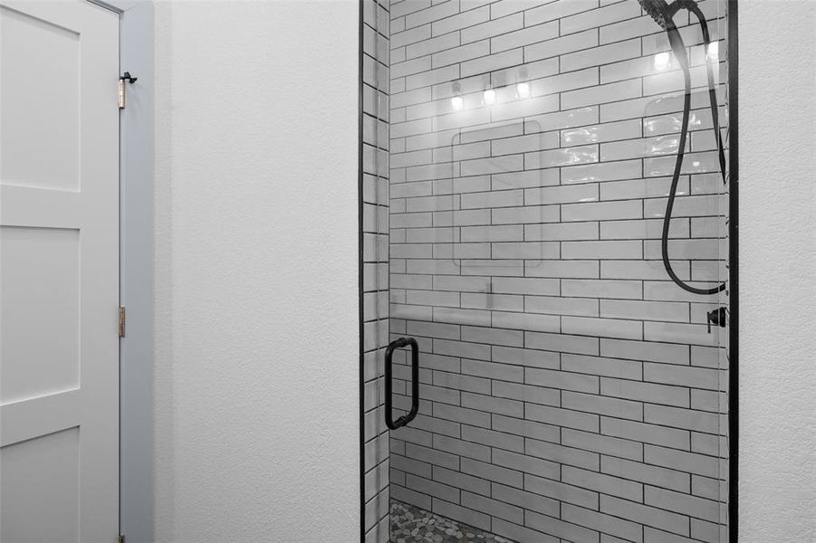 Bathroom featuring a shower stall