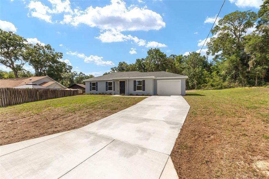 Front exterior of a new home in , Ocala, FL, highlighting curb appeal (Image 2).