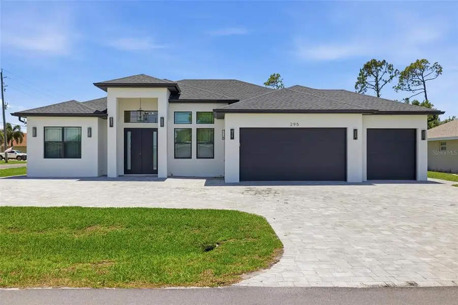 Front exterior of a new home in , Rotonda West, FL, highlighting curb appeal (Image 28). Front exterior of a new home in , Rotonda West, FL, highlighting curb appeal (Image 28).