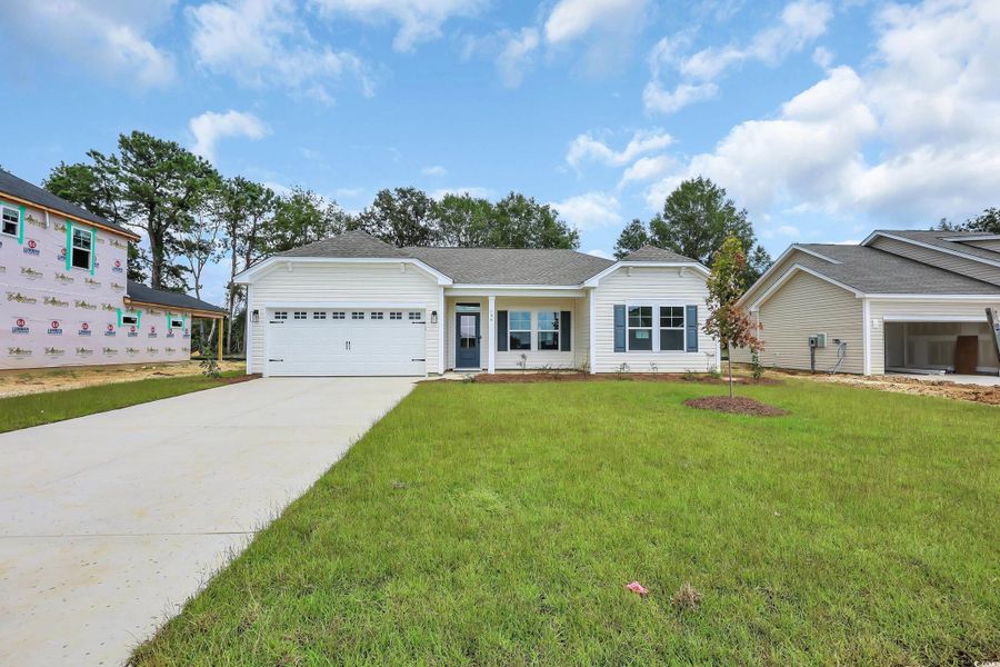 Front exterior of a new home in Briarfield, Conway, SC, highlighting curb appeal (Image 1).