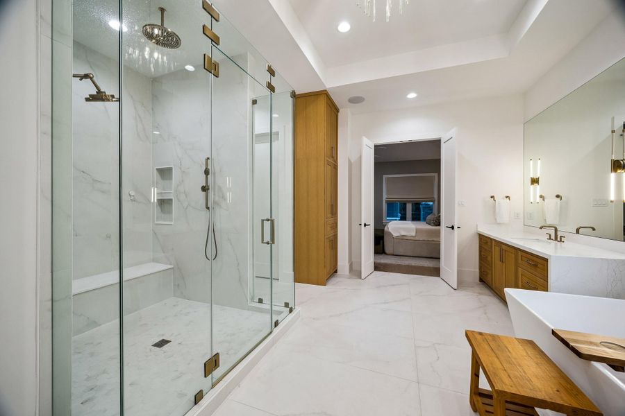 A view of the bathroom looking into the primary bedroom.