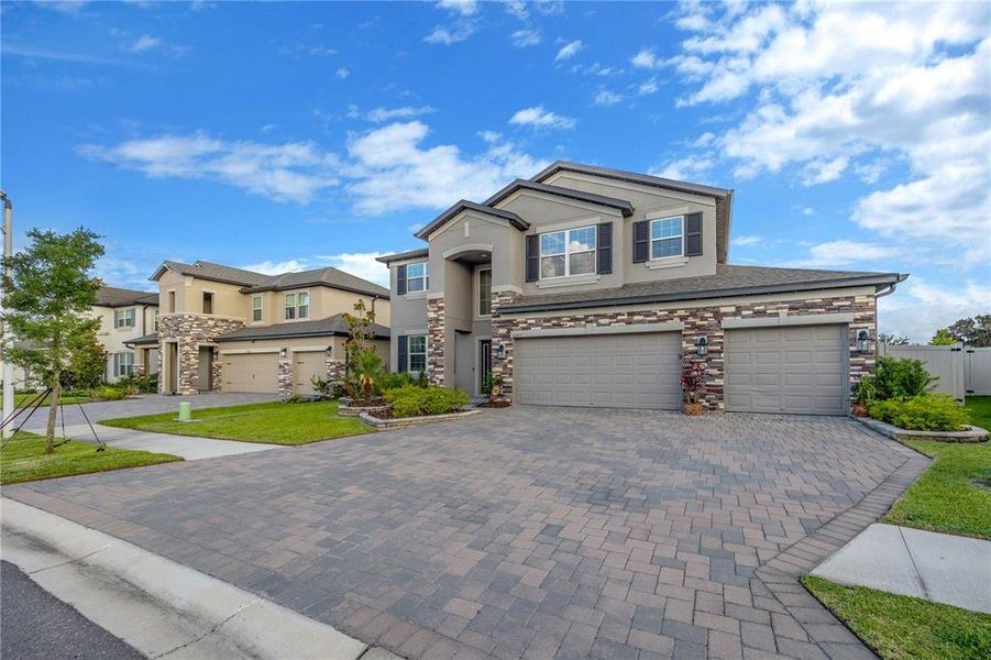Front exterior of a new home in , Wesley Chapel, FL, highlighting curb appeal (Image 28).