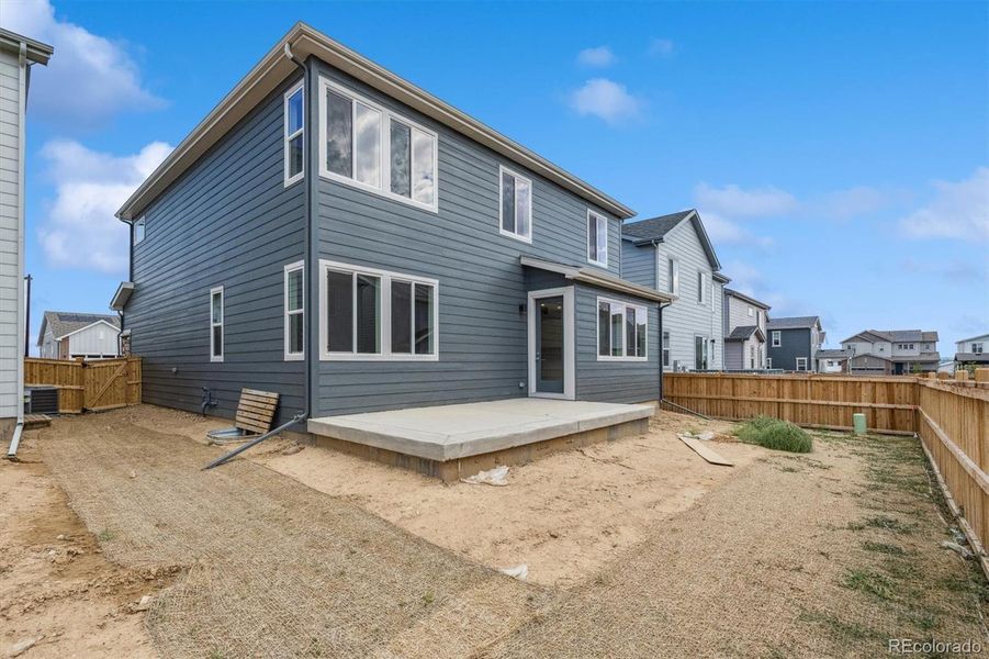 Exterior details and patio area of a home in Floret Collection at Parkdale Commons, Erie (Image 3).