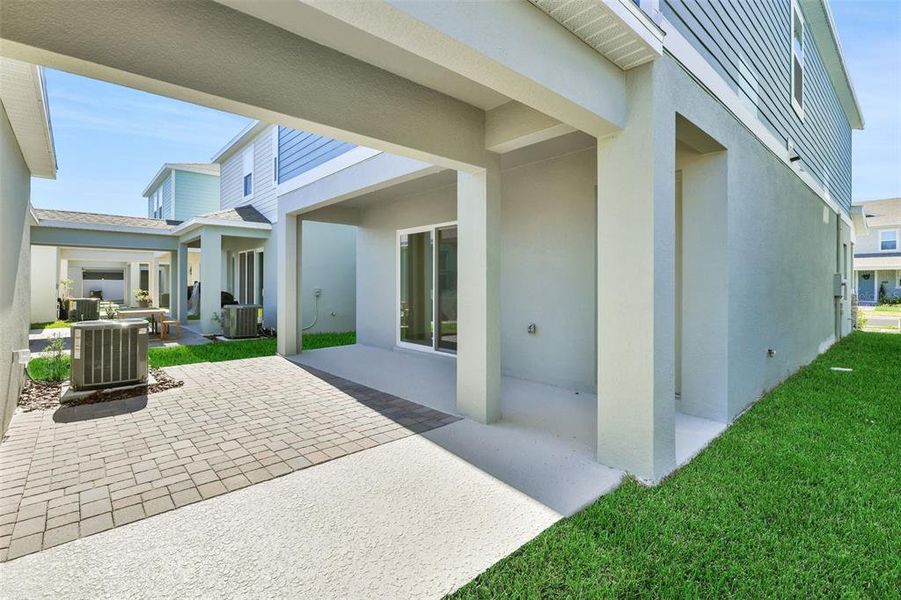Exterior details and patio area of a home in Serenade at Ovation, Winter Garden (Image 3). Exterior details and patio area of a home in Serenade at Ovation, Winter Garden (Image 3).