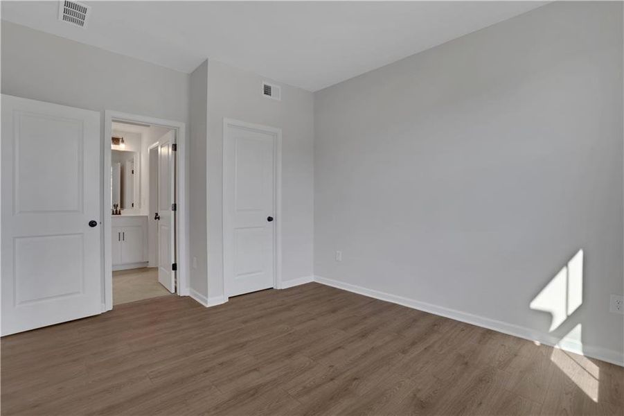 Spacious, unfurnished interior of a new home in The Paddocks at Doc Hughes, Buford (Image 33).