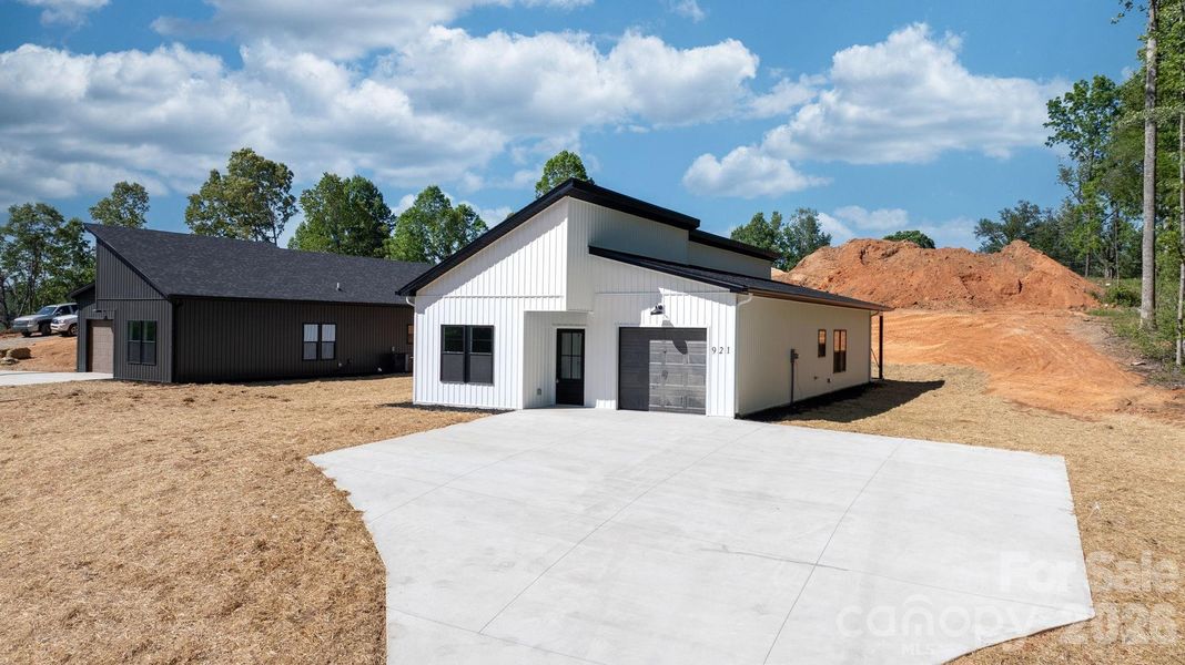 Front exterior of a new home in , Lenoir, NC, highlighting curb appeal (Image 19).