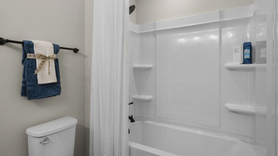 Second-floor bathroom shower with functional design and stylish finishes.