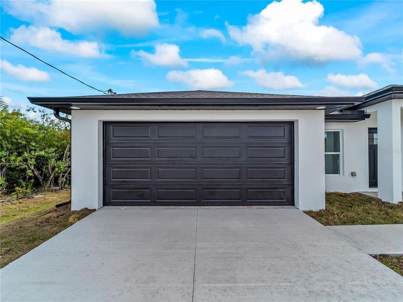 Front exterior of a new home in , Port Charlotte, FL, highlighting curb appeal (Image 30).