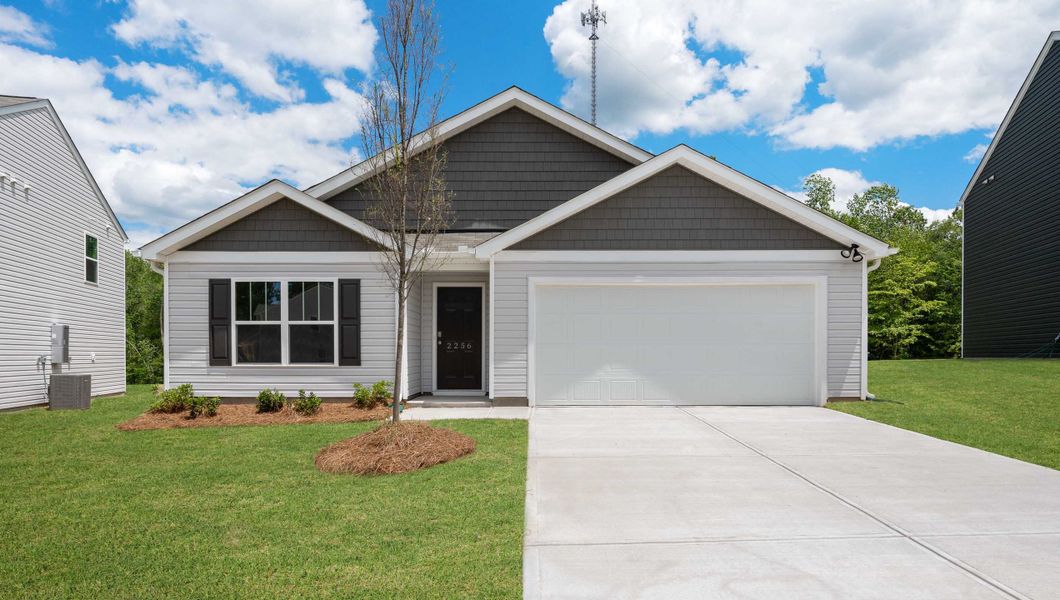 Front exterior of a new home in Harrier Point, Woodruff, SC, highlighting curb appeal (Image 1). Front exterior of a new home in Harrier Point, Woodruff, SC, highlighting curb appeal (Image 1).