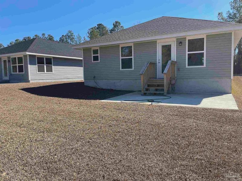 Exterior details and patio area of a home in Turtle Creek, Cantonment (Image 4).