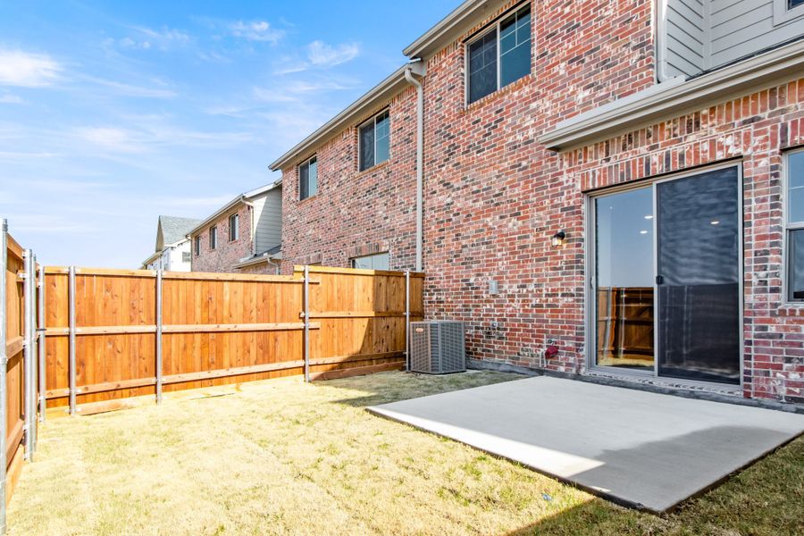 Exterior details and patio area of a home in Wildridge, Oak Point (Image 21).