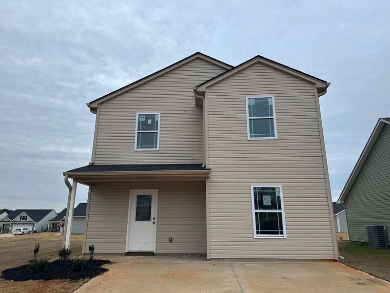 Front exterior of a new home in Gentry Place, Spartanburg, SC, highlighting curb appeal (Image 1). Front exterior of a new home in Gentry Place, Spartanburg, SC, highlighting curb appeal (Image 1).