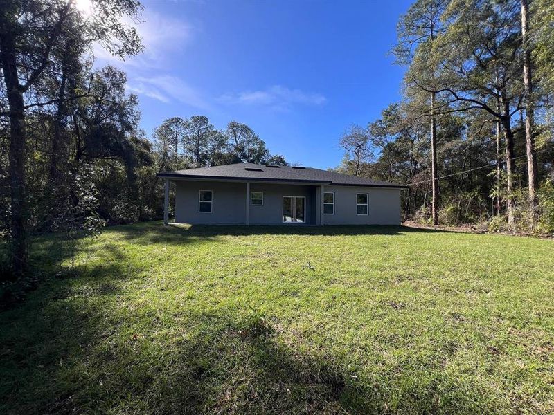 Exterior details and patio area of a home in , Citrus Springs (Image 24).