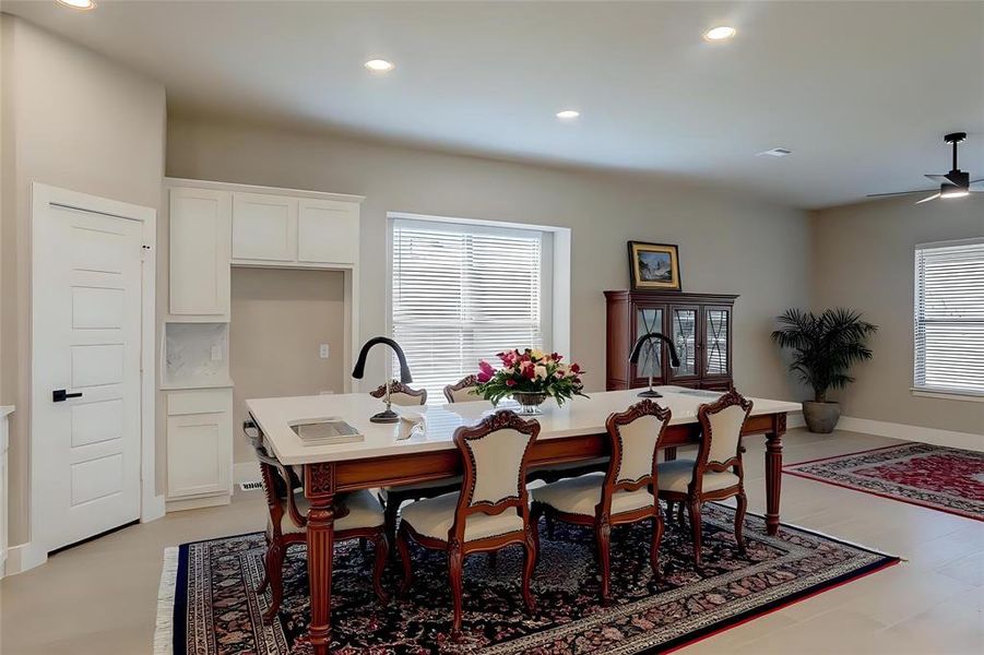 Dining area with recessed lighting, plenty of natural light, and a ceiling fan Dining area with recessed lighting, plenty of natural light, and a ceiling fan