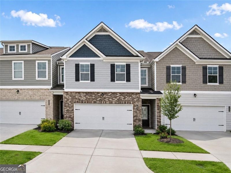 Front exterior of a new home in Creekside Village Phase II, Lithonia, GA, highlighting curb appeal (Image 1). Front exterior of a new home in Creekside Village Phase II, Lithonia, GA, highlighting curb appeal (Image 1).