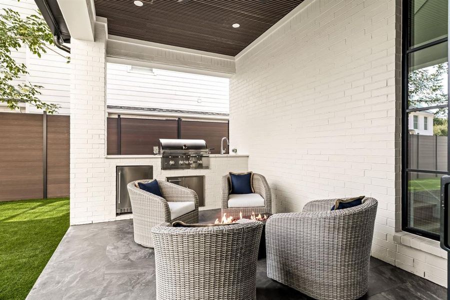 View of patio / terrace featuring exterior kitchen View of patio / terrace featuring exterior kitchen