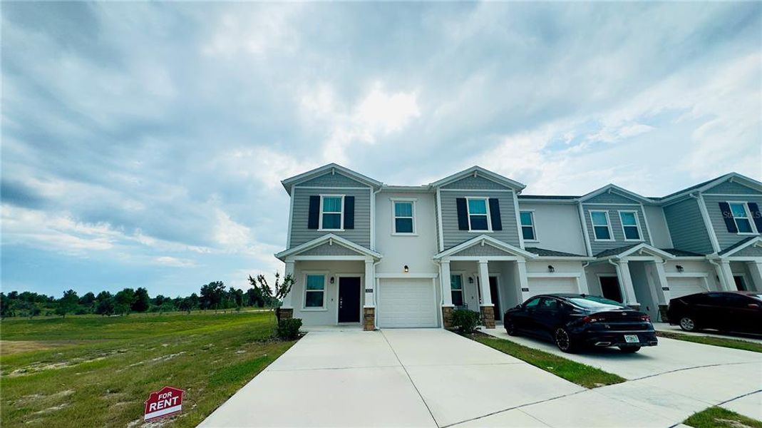 Front exterior of a new home in , Davenport, FL, highlighting curb appeal (Image 2). Front exterior of a new home in , Davenport, FL, highlighting curb appeal (Image 2).