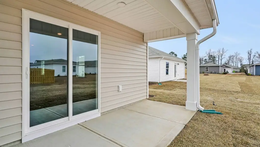 Exterior details and patio area of a home in Lockwood Landing, Supply (Image 2). Exterior details and patio area of a home in Lockwood Landing, Supply (Image 2).