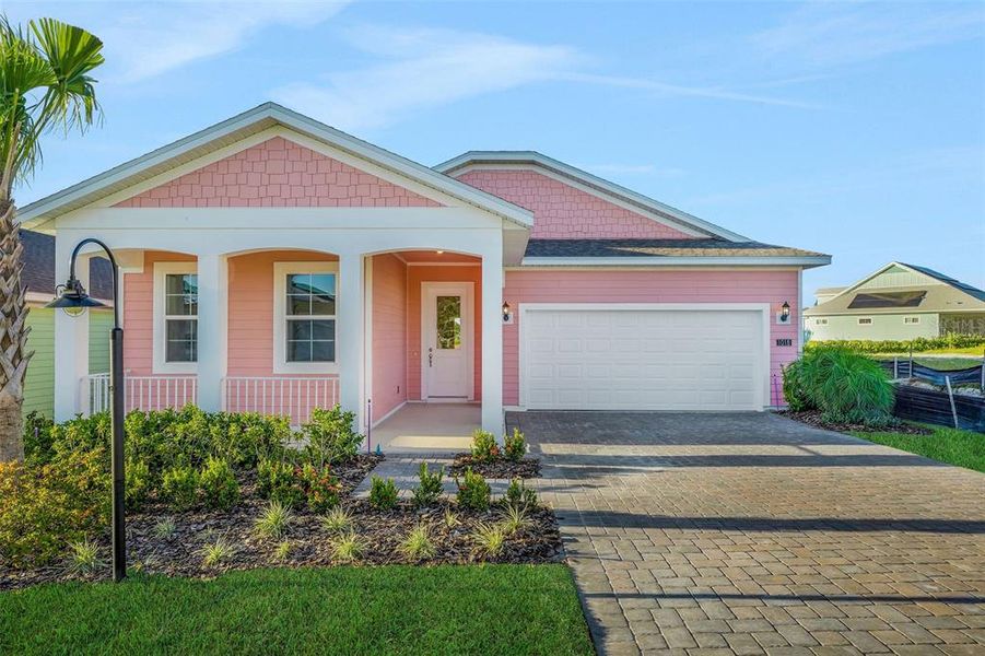 Front exterior of a new home in Green Key Village, Lady Lake, FL, highlighting curb appeal (Image 26).