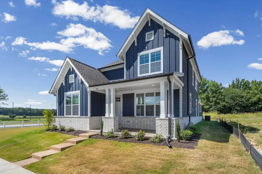 Two-story home with blue horizontal siding and white trim