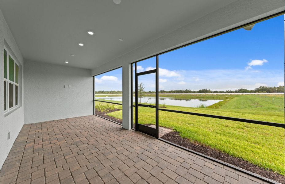 Exterior details and patio area of a home in Shores at Stillwater, Englewood (Image 21).