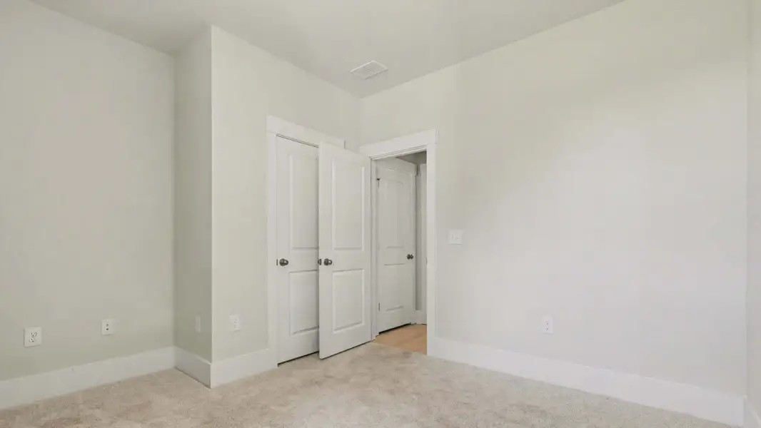 Representative unfurnished interior of a home built from the Woodstock by D.R. Horton in Riverlake, Supply (Image 11).