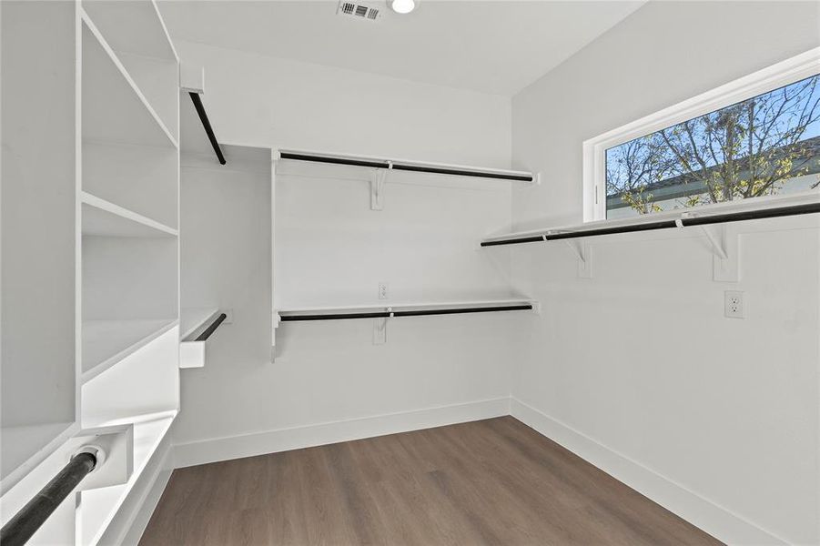 Spacious closet featuring hardwood / wood-style floors