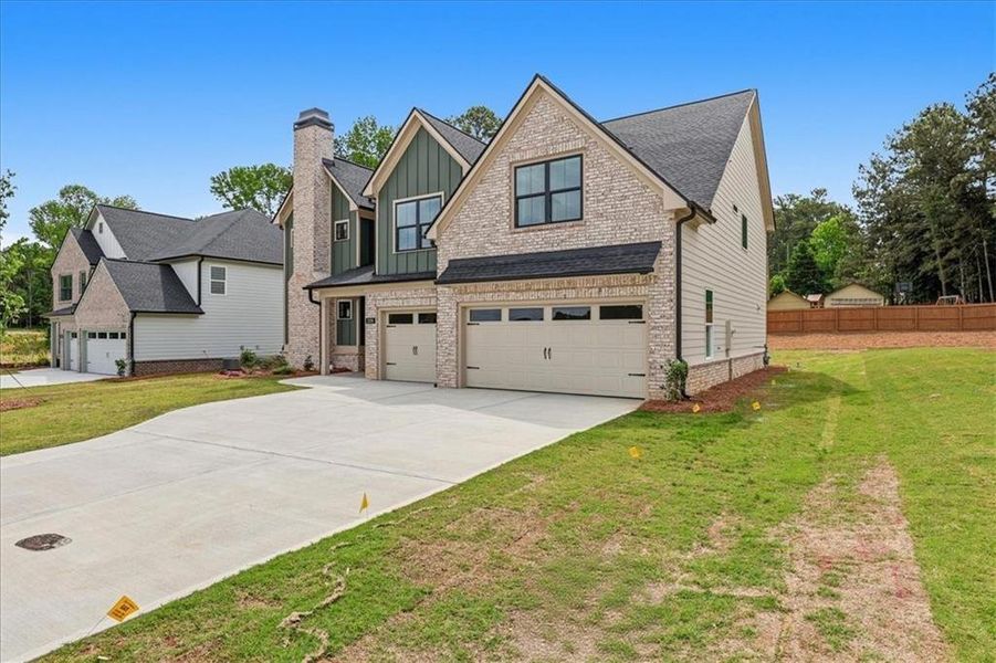 Front exterior of a new home in , Lawrenceville, GA, highlighting curb appeal (Image 28).