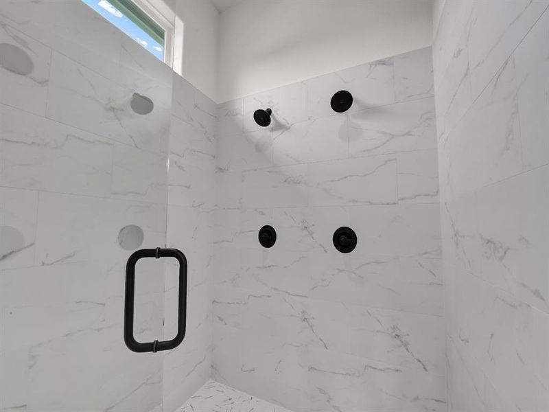 Bathroom featuring a stall shower Bathroom featuring a stall shower