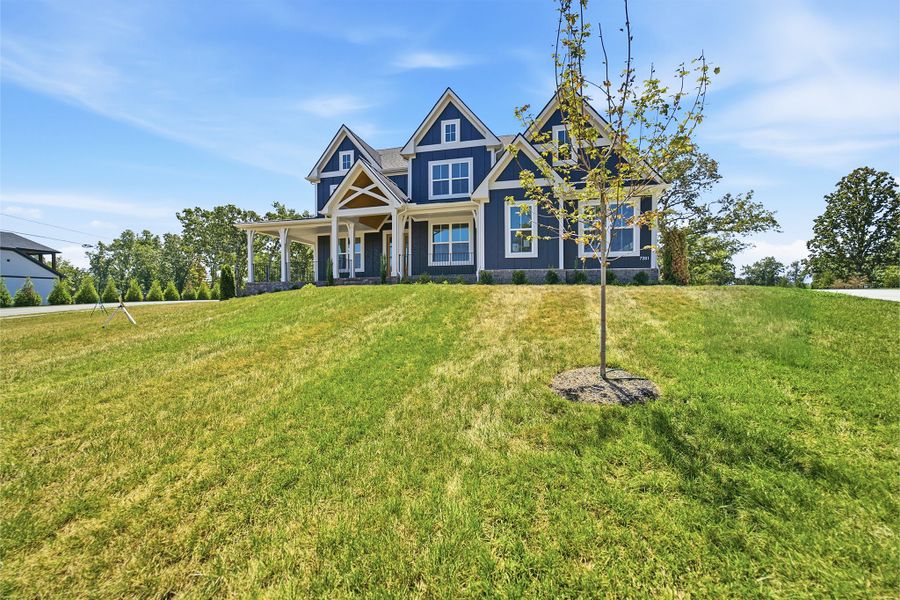 Front exterior of a new home in Belvoir, Fairview, TN, highlighting curb appeal (Image 28). Front exterior of a new home in Belvoir, Fairview, TN, highlighting curb appeal (Image 28).