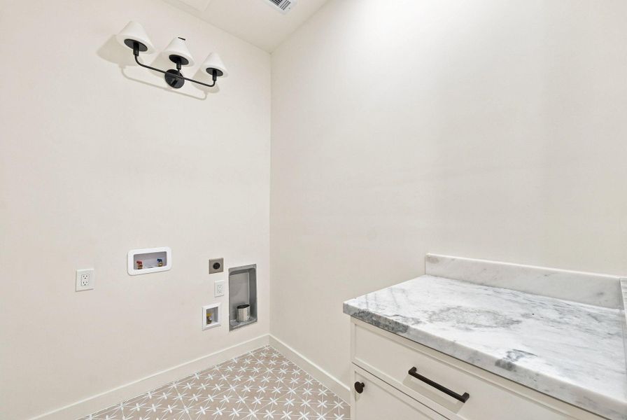 Dedicated laundry for upstairs use.