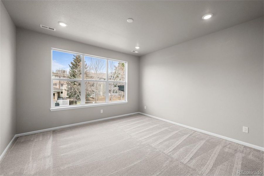 Spacious, unfurnished interior of a new home in Ralston Creek, Arvada (Image 28).