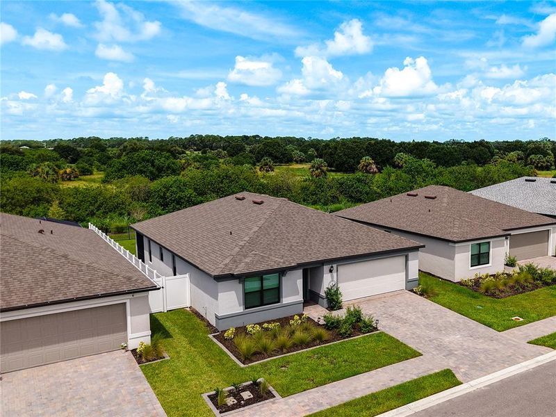 Front exterior of a new home in Caloosa Cove, Labelle, FL, highlighting curb appeal (Image 27).