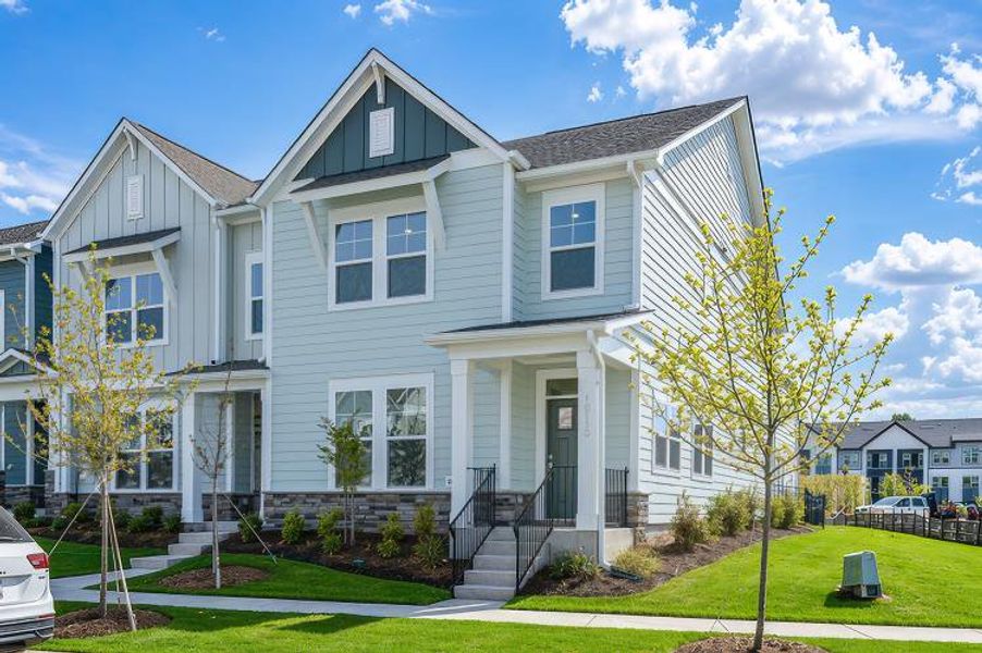 Front exterior of a new home in North Creek Village - Townhomes, Huntersville, NC, highlighting curb appeal (Image 1). Front exterior of a new home in North Creek Village - Townhomes, Huntersville, NC, highlighting curb appeal (Image 1).