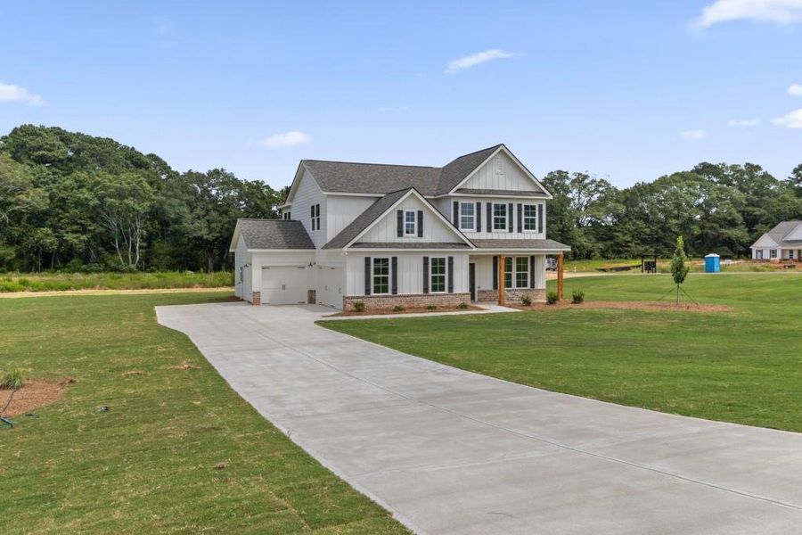 Front exterior of a new home in , Good Hope, GA, highlighting curb appeal (Image 23).