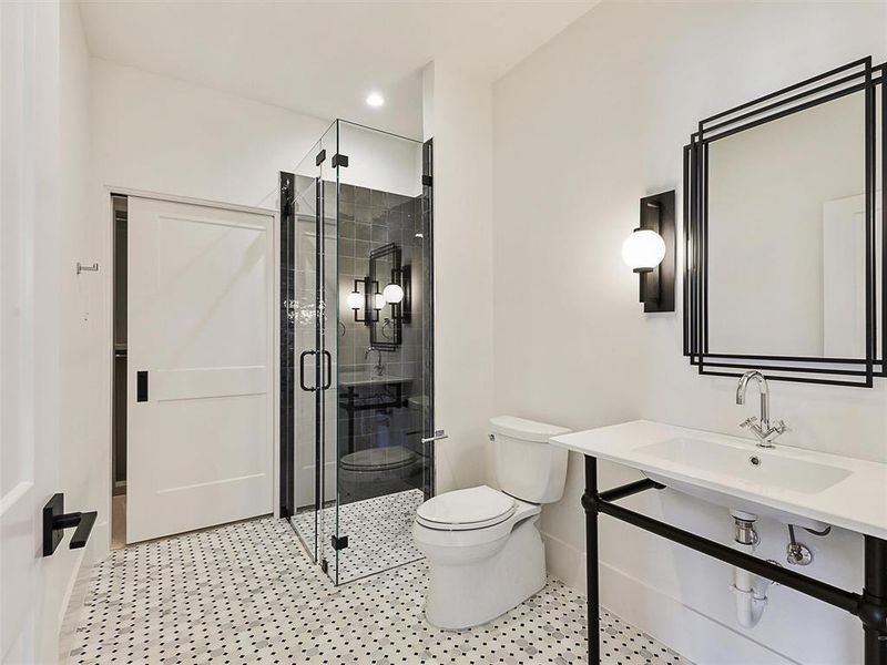 Bathroom with walk in shower, toilet, and sink