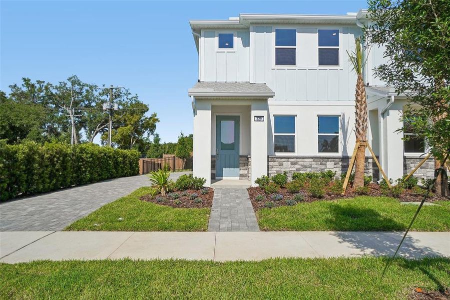 Front exterior of a new home in The Brooke, Brandon, FL, highlighting curb appeal (Image 22).