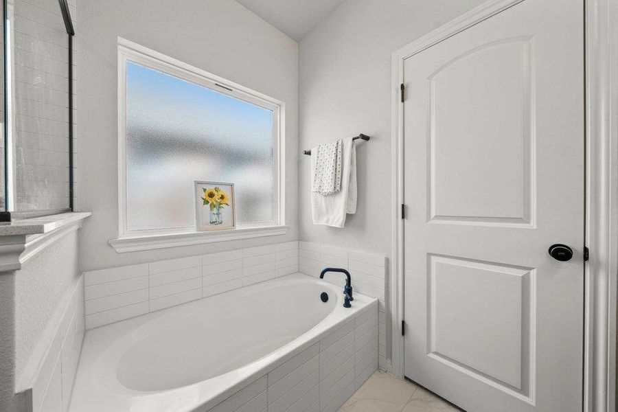 Full bathroom with a garden tub