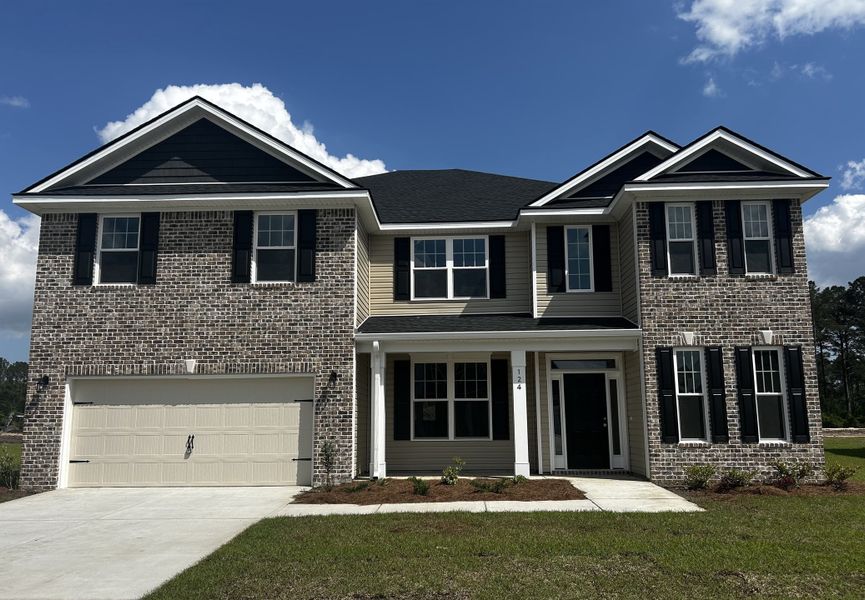 Front exterior of a new home in Camden Crossing, Savannah, GA, highlighting curb appeal (Image 1).
