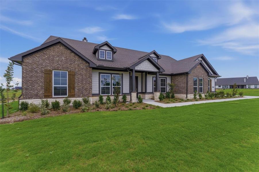 Modern brick and siding exterior with dark trim accents