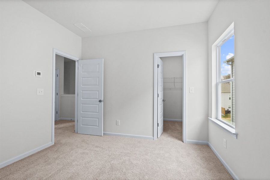 The Dove- Bedroom 3. Home under construction, photo used for illustrative purposes only, colors and options will vary.