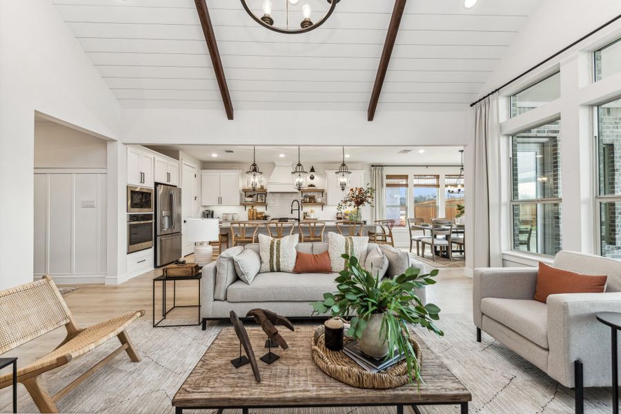 Great room with vaulted ceiling and shiplap