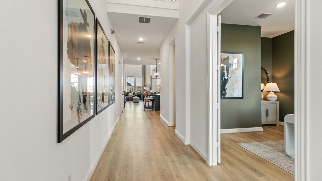 Representative furnished interior of a home built from the Rosewood by Brightland Homes in Sunterra, Katy (Image 5).