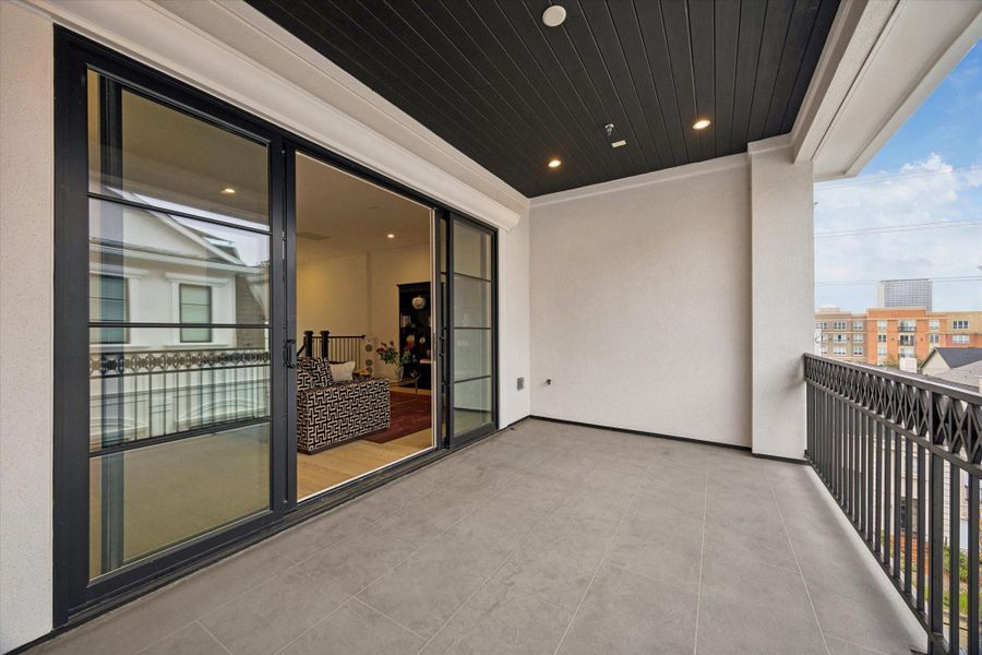 Spacious terrace off of the 4th floor with sliding glass doors and gas and water connections